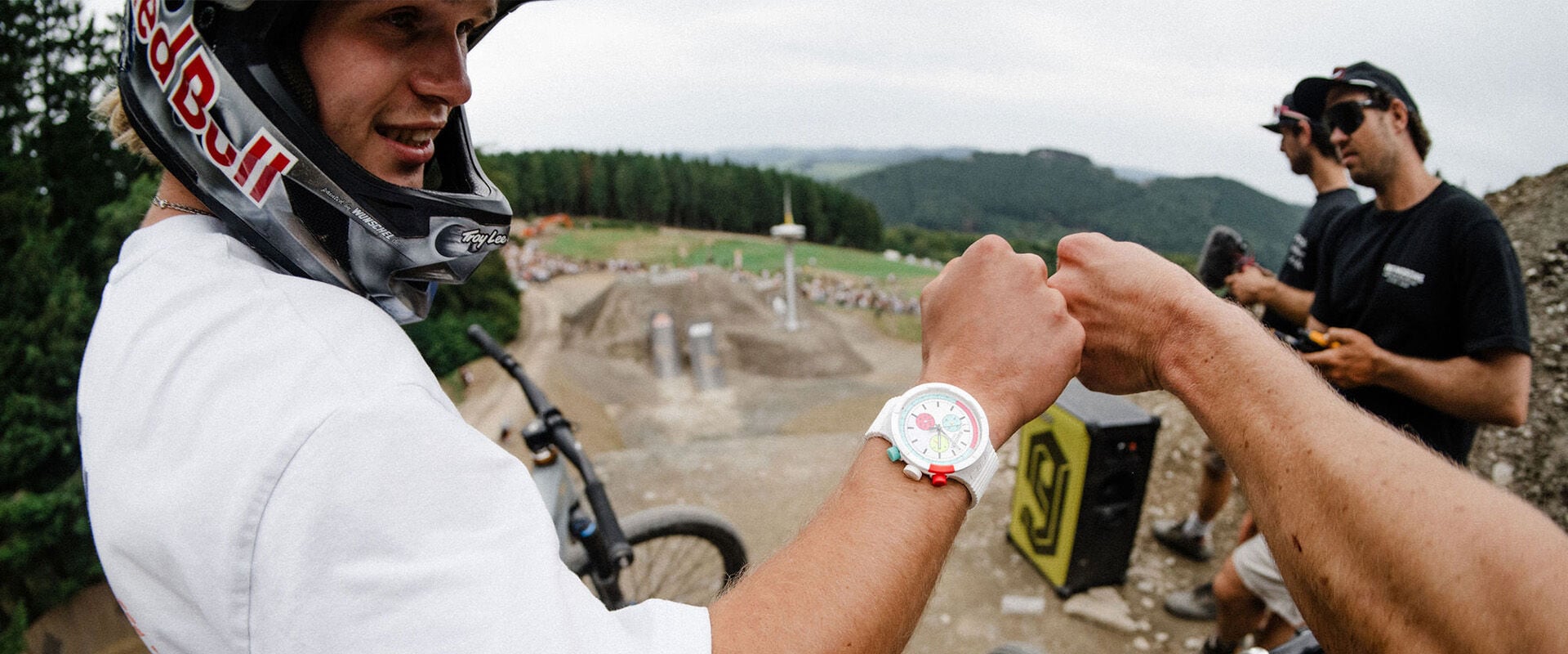 Erik Fedko fist bumping a fellow rider